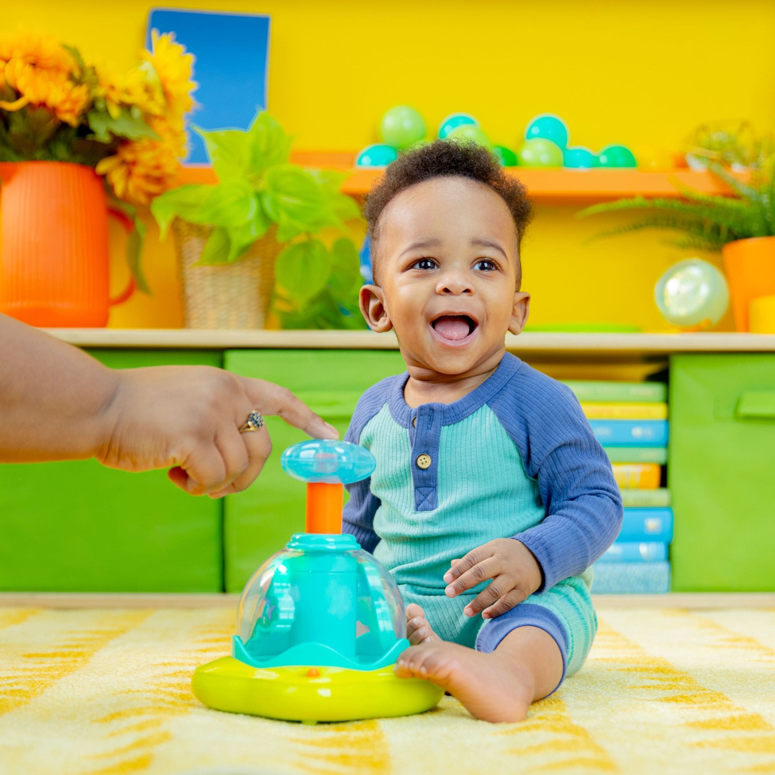 Bright Starts Drücken und Glüh Spinner Spielzeug